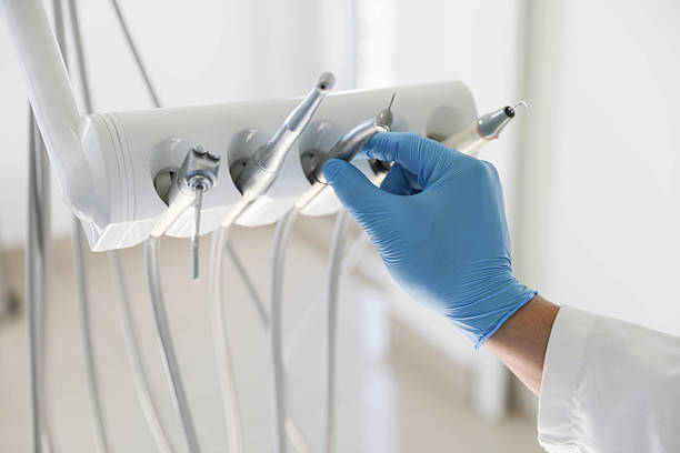 Professional Tooth Extraction technician working in University Park, TX